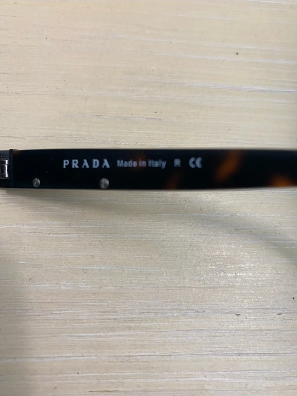 Prada Black Frame Sunglasses with Dark Green Lenses